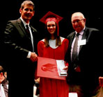 Director Mike O’Shea presenting a U&H scholarship to local high school student